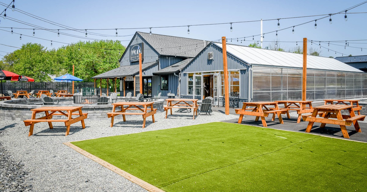 Exterior, picnic tables near grass area and fire pit