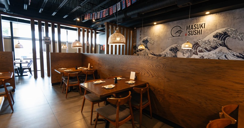 Interior with wood accents, bamboo pendant lighting and a large mural