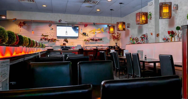 Interior of a modern restaurant with black leather seating