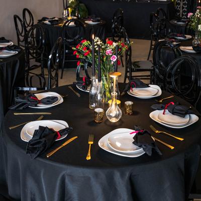 Round dining table, fully set.