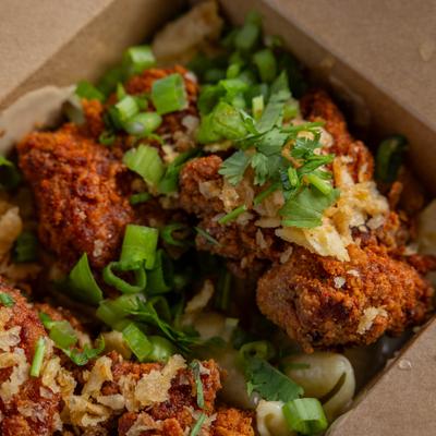 Crispy fried chicken topped with herbs and scalion.