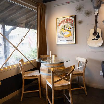 Barrel table and chairs in the corner.