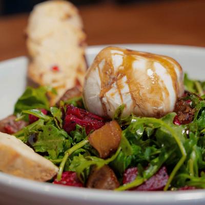 Beet salad, with balsamic glazed burrata cheese, arugula, and toast.