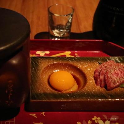 Grilled beef and an egg yolk