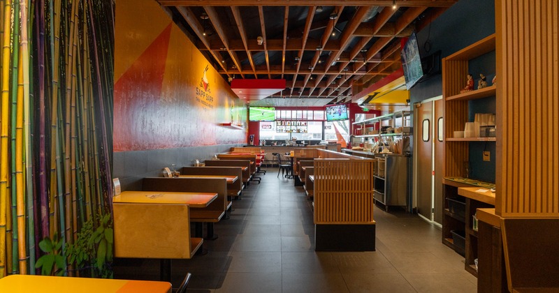 Interior, dining area, seating booths with wooden top tables, tile flooring