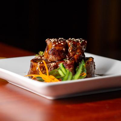 Teriyaki sauce glazed thin-sliced beef, rolled with scallion and grilled.