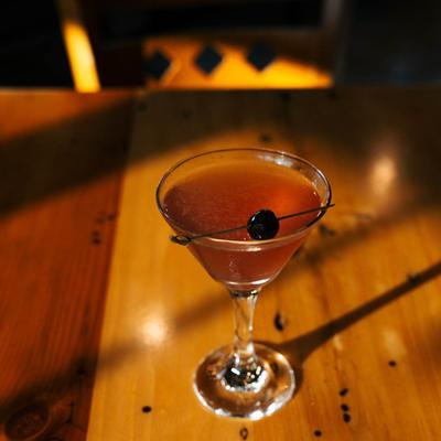 Spring martini garnished with a cherry.