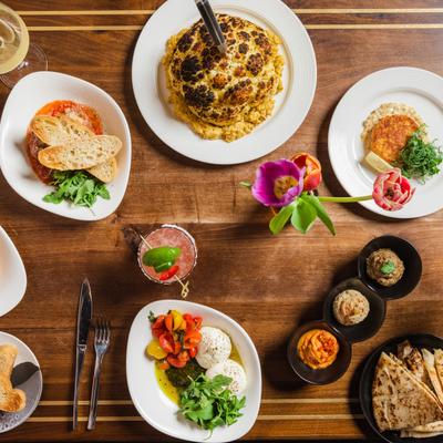 Various food and drinks on the tables, top view