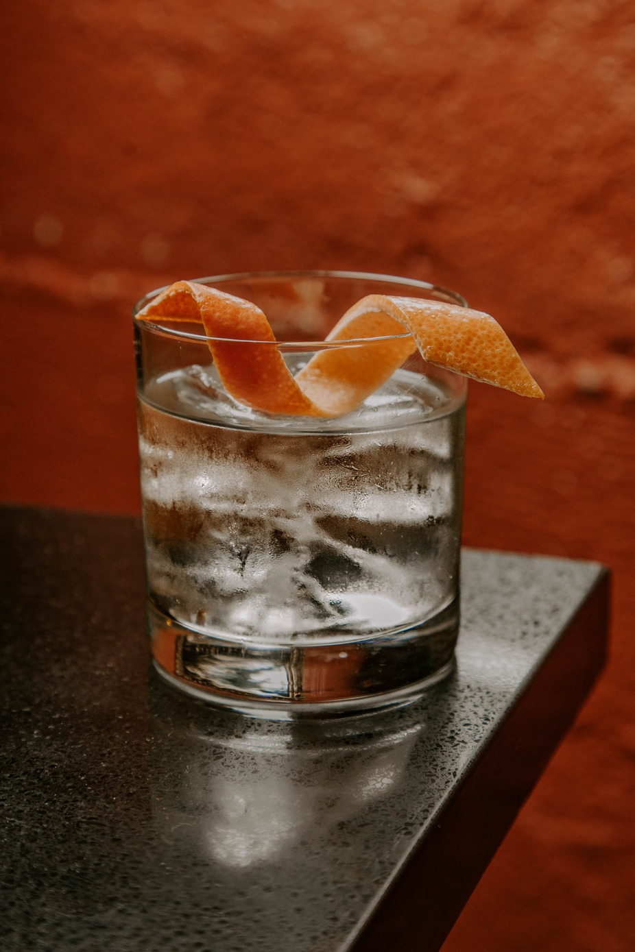 Cocktail drink with an orange peel
