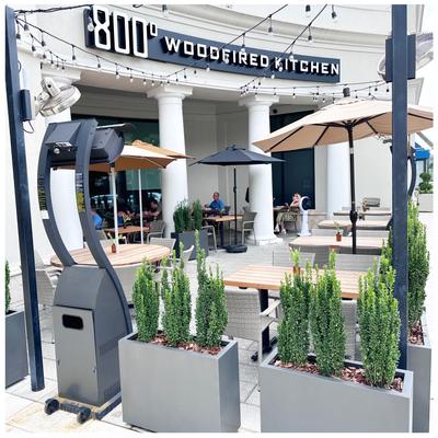 Exterior, seating area, benches, tables, and parasols