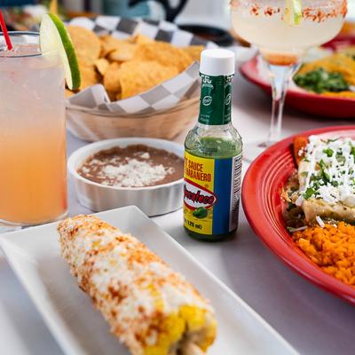 Assorted dishes and drinks on the table.