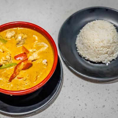 Red Curry, with coconut milk, bell peppers, mushrooms, bamboo, basil, and a side of rice.