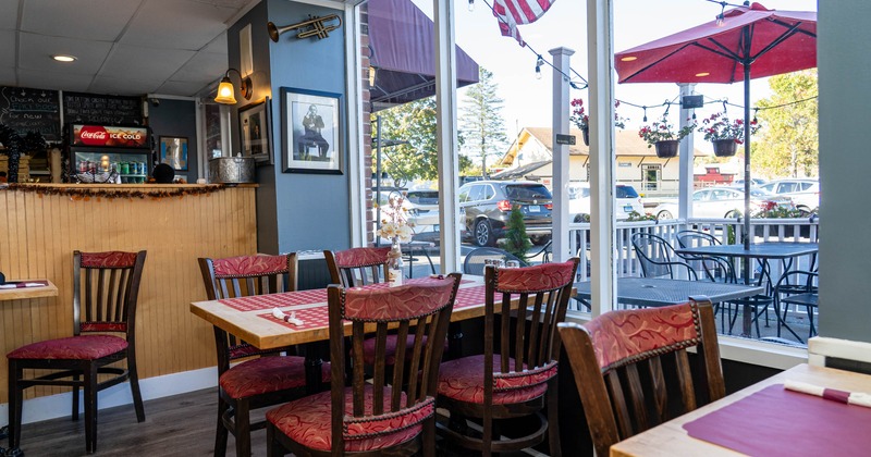 Interior, chairs and tables next  to the window