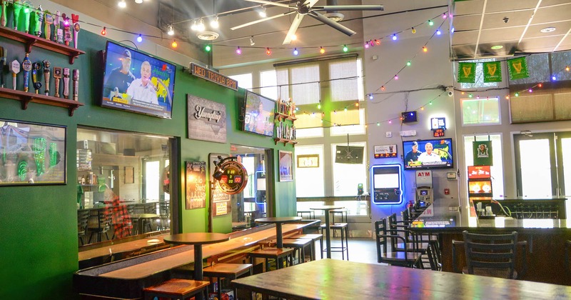 Bar area and tables, TVs on the walls