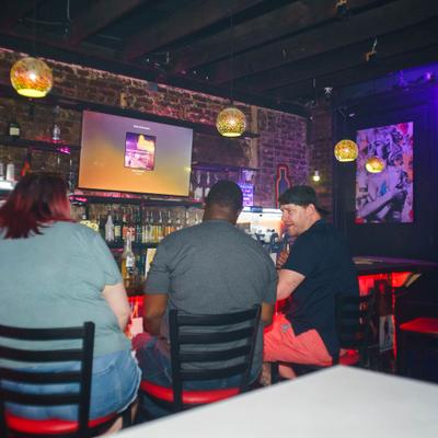 Guests sitting at the bar.