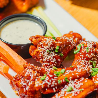 Wings served with celery, carrots, and blue cheese dipping sauce.