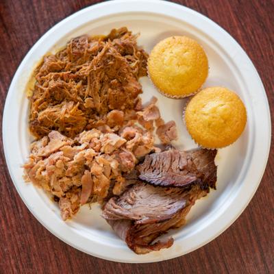 Three meat combination platter, served, top view.