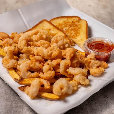 Fried shrimp with fries, toast, and cocktail sauce.