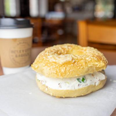 Bagel with cream cheese, scallions and bacon