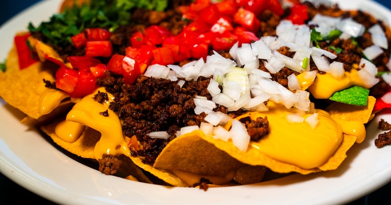 A plate of loaded nachos