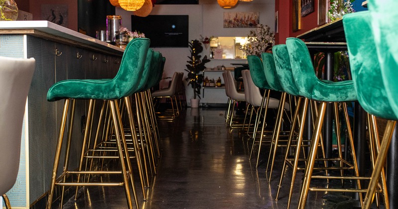 Interior, bar area, bar stools lined up