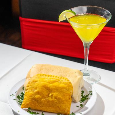 Stuffed patty, cornbread, and a cocktail.
