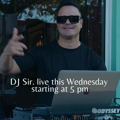 Dj playing at calle dragones terrace.