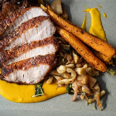 Pork chops with vegetables, top view.