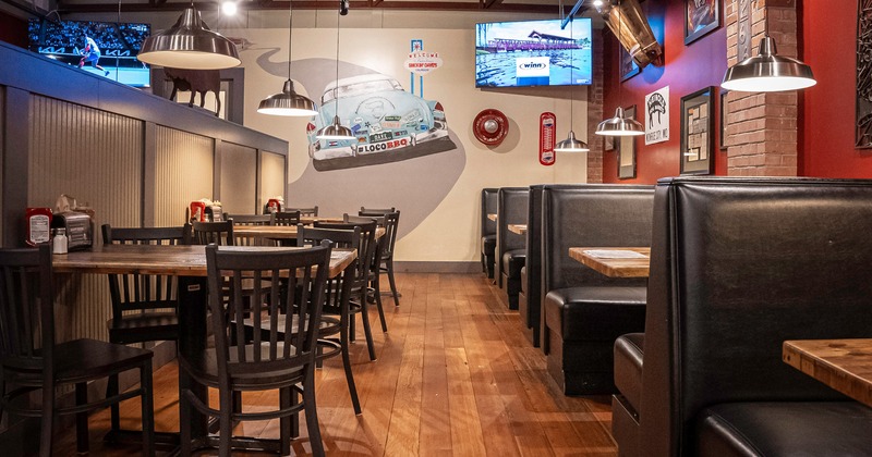 Interior, dining area with dining tables and chairs and dining booths