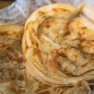 Flaky layered flatbread.