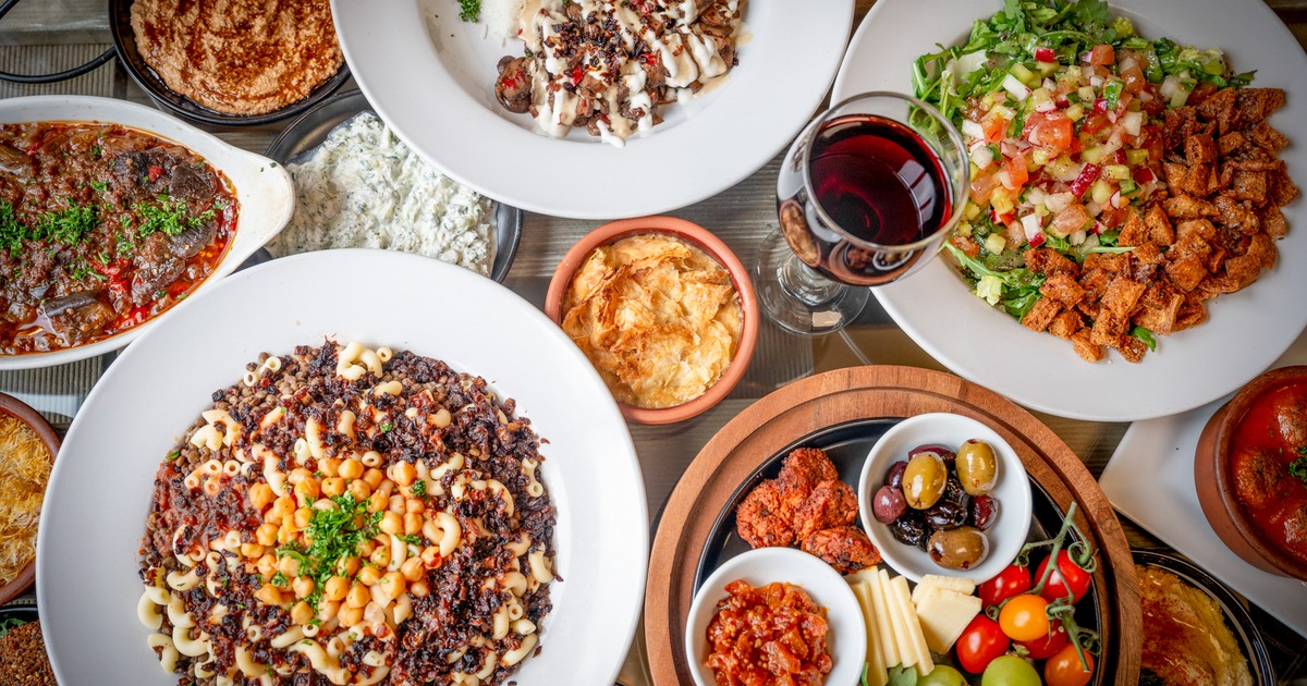 Assorted food dishes displayed on a table, top down view