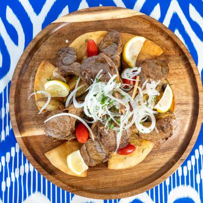 Jiz Biz, fried lamb chops with potatoes and fresh onions.