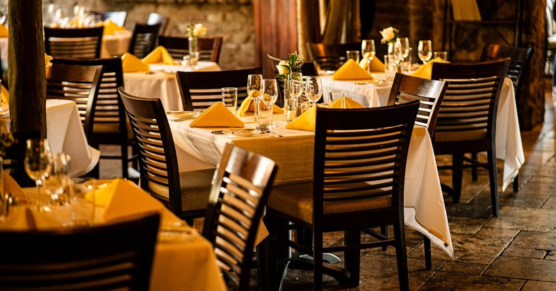 Interior, tables with chairs waiting for the guests