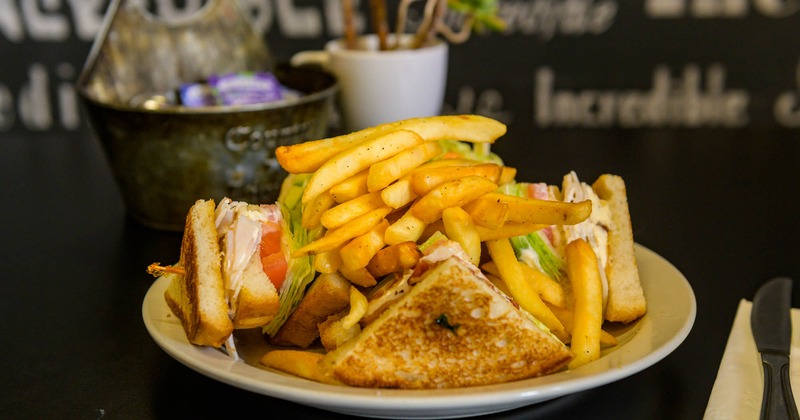 Club sandwich with fries