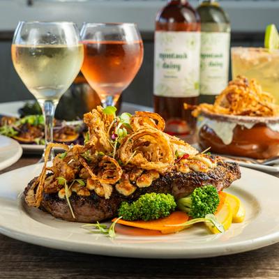 Grilled steak, with crispy onions and veggies.