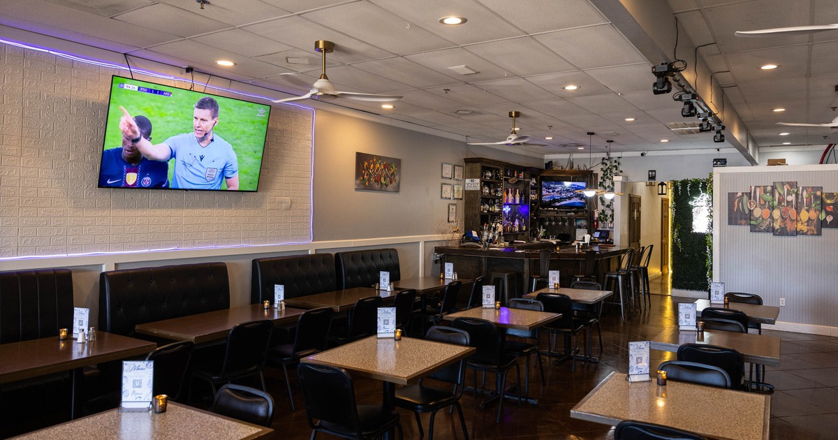 Interior, seating area with a bar in the back