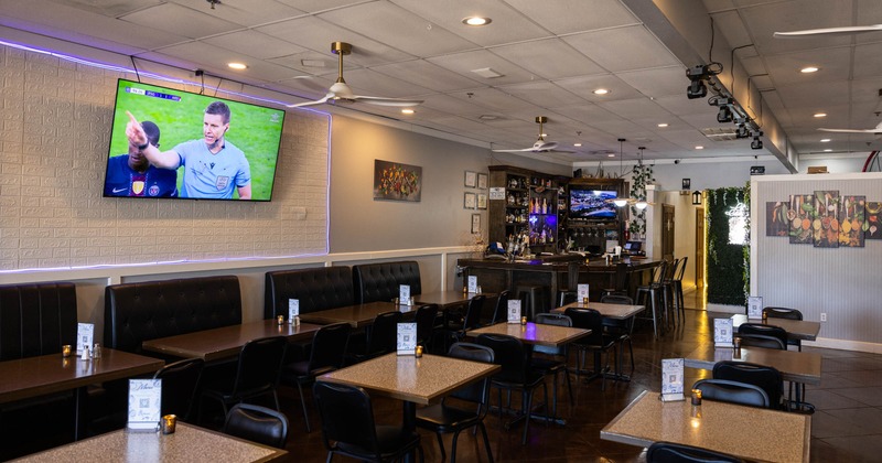 Interior, seating area with a bar in the back