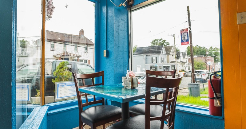 Interior, table for two in the corner by the window