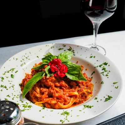 Tagliatelle alla Bolognese and red wine.