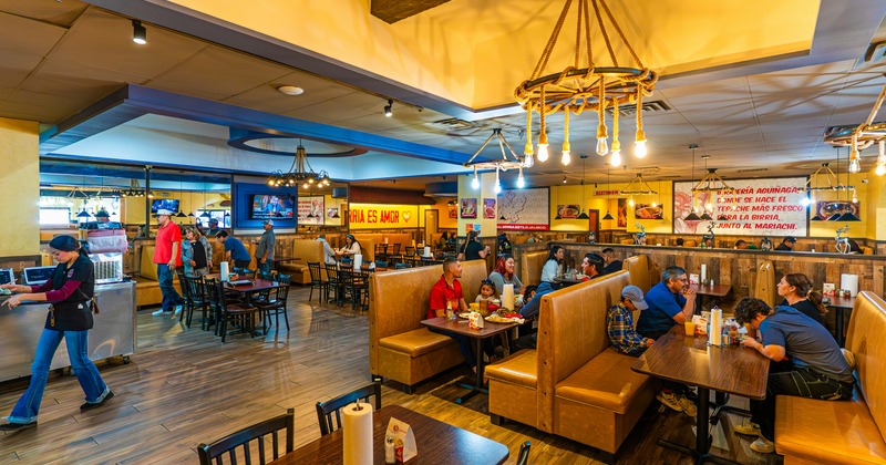 Interior, seating area with tables, chairs and booths