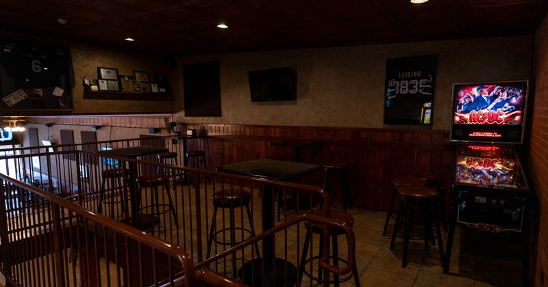 Seating space with tall tables and bar stools