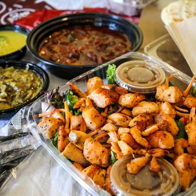 Fried meat dish in the front, various sides in the back