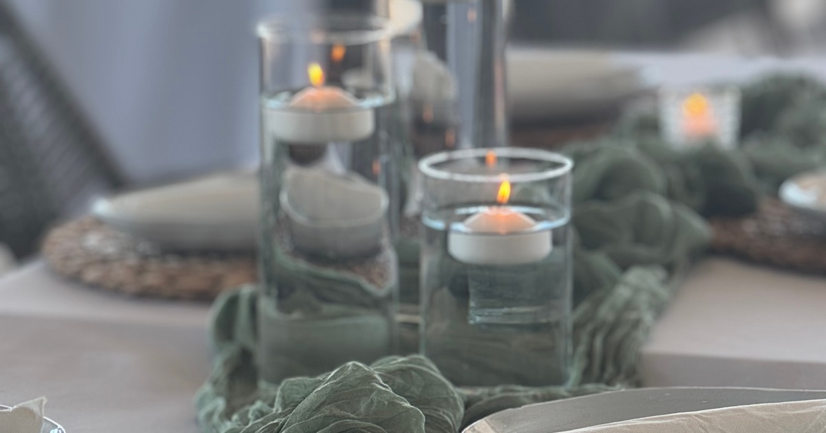 Glass cylinders with floating candles