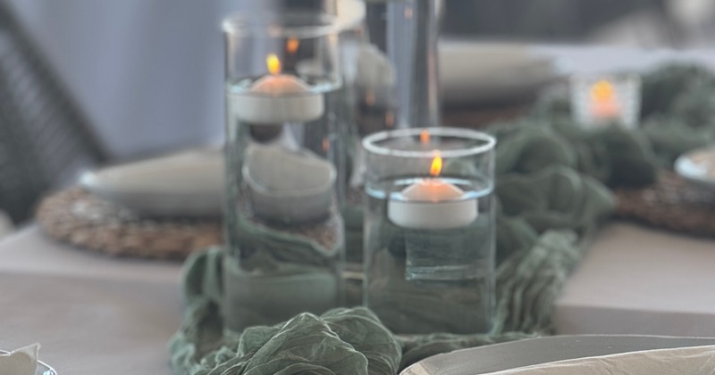 Glass cylinders with floating candles