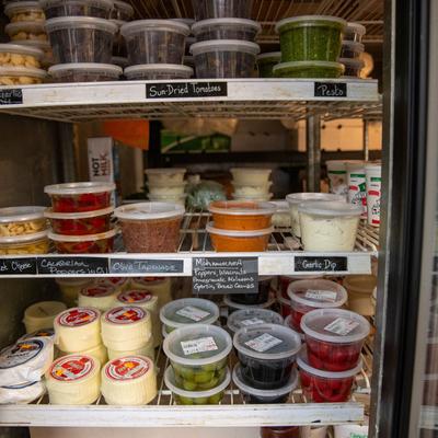 A fully stocked fridge with a variety of food and other items.