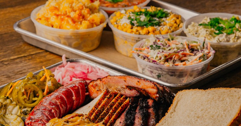 BBQ plate with a plate of side dishes