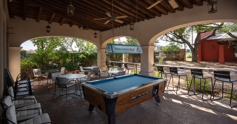 Covered patio, seating area with a pool table