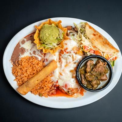 Mexican plate with cheese enchilada, chili relleno, beef flauta, and green chili.