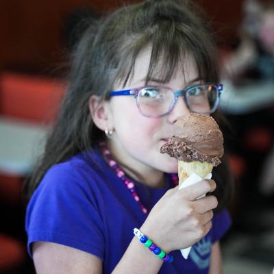 young girl eating ice cream cones.