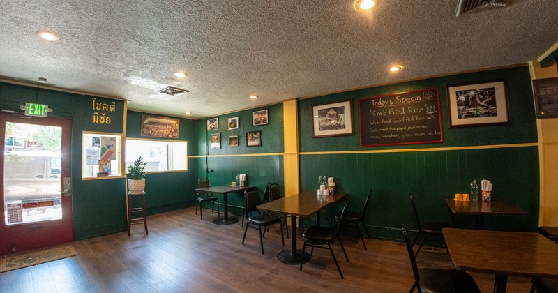 Interior, restaurant entrance, dining area, tables with chairs, ready for guests